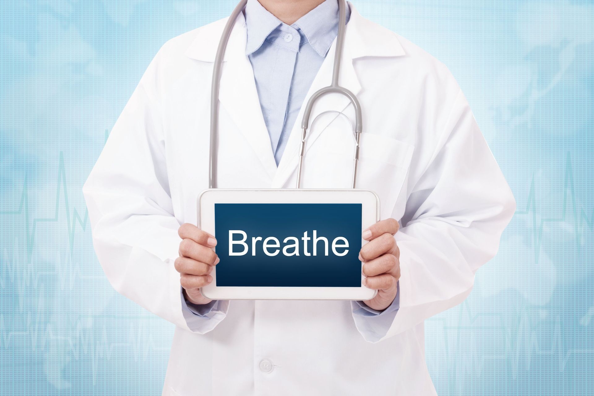 Doctor holding a tablet pc with breathe sign on blue background