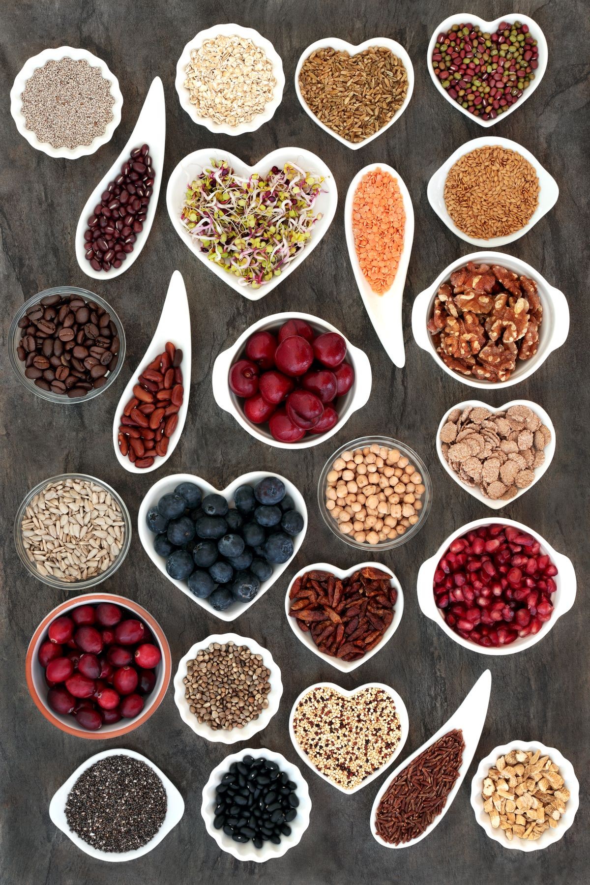 Vegan and vegetarian dried and fresh health food with fruit, vegetables, cereals, nuts, seeds, coffee, grains and herbs with super foods high in antioxidants, anthocyanins, dietary fibre and vitamins.
