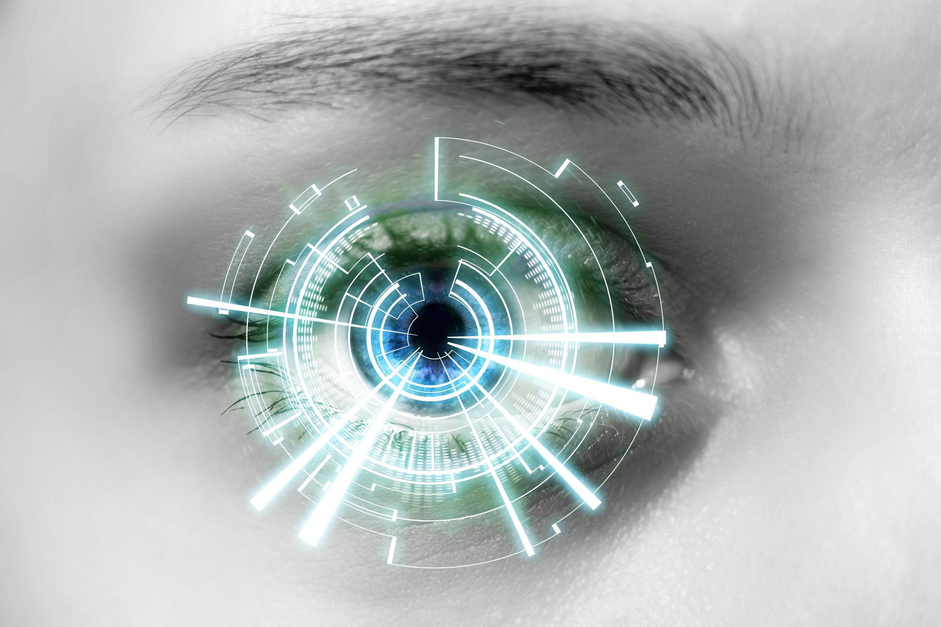 View of the Eye of a woman with digital interface in front of it 